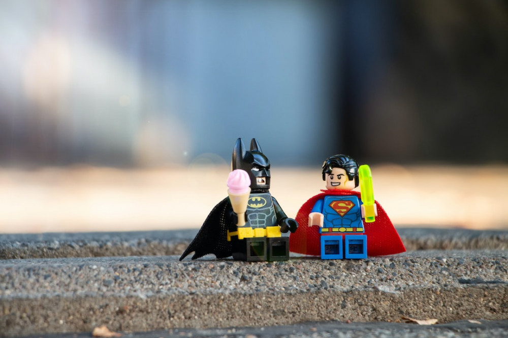 Wealthy Affiliate vs OLSP System & Traffic Domination: Superman Vs Batman